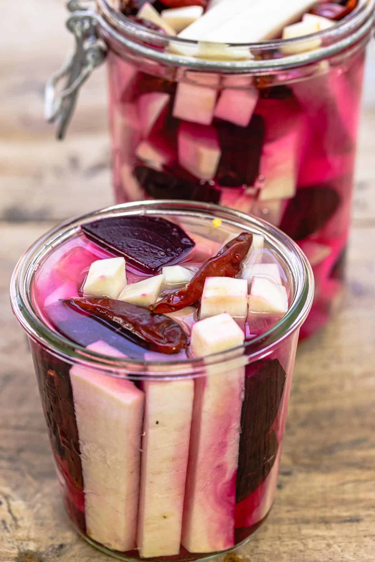 turnip batons in mason jars with pickling brine, beets, and dried chiles
