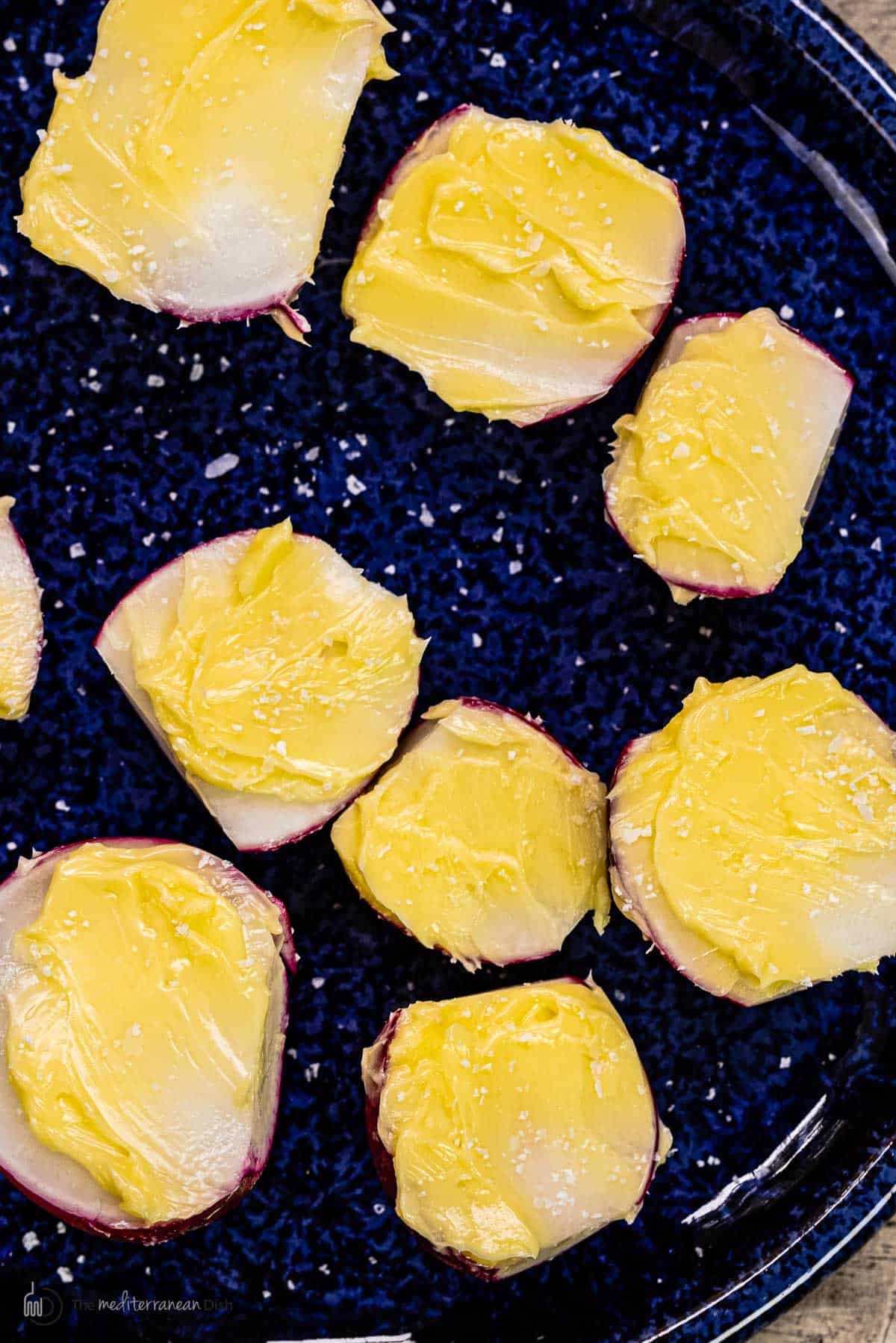 Cut radish halves with butter on top