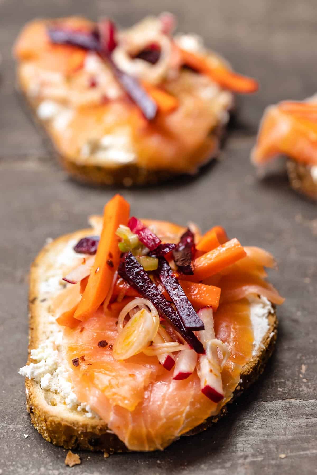 smoked salmon sandwich with feta cheese, salmon, and vegetables