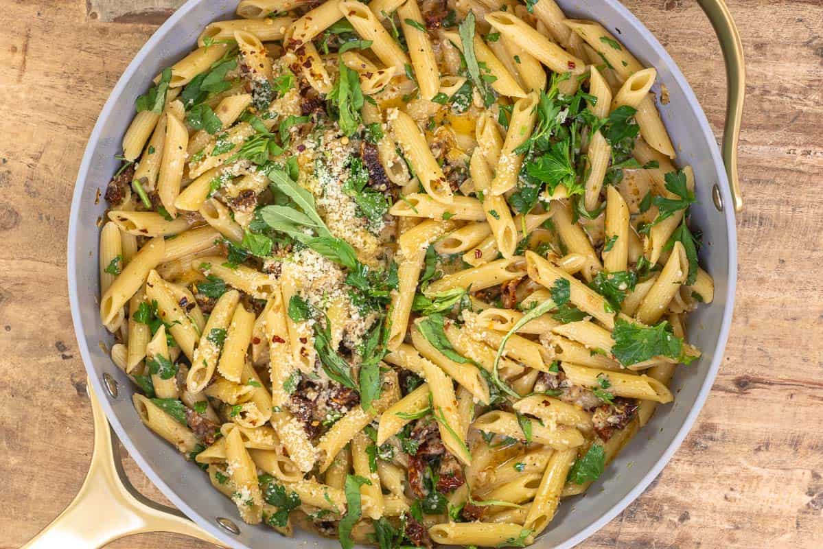 pasta with sundried tomatoes, fresh basil, parmesan cheese, and red pepper flakes