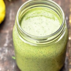 green tahini sauce in a Mason jar