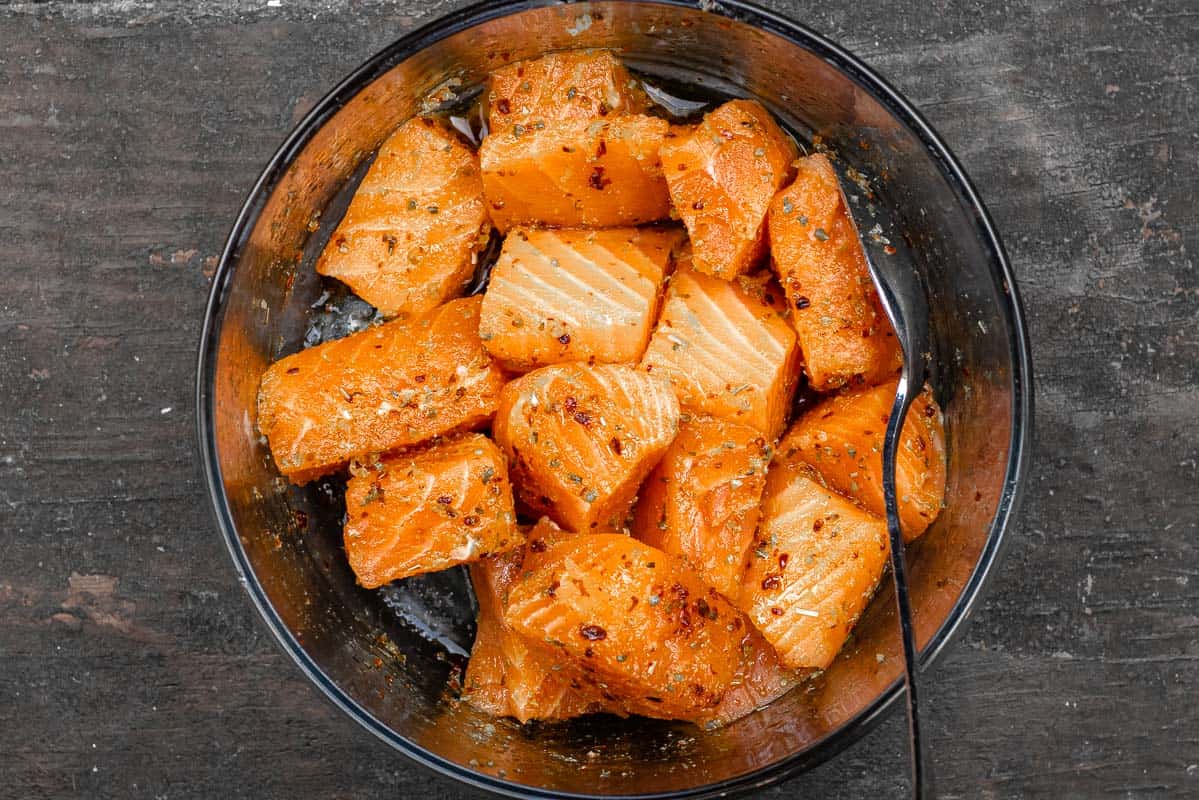 seasoned cubes of center-cut salmon fillet in a bowl