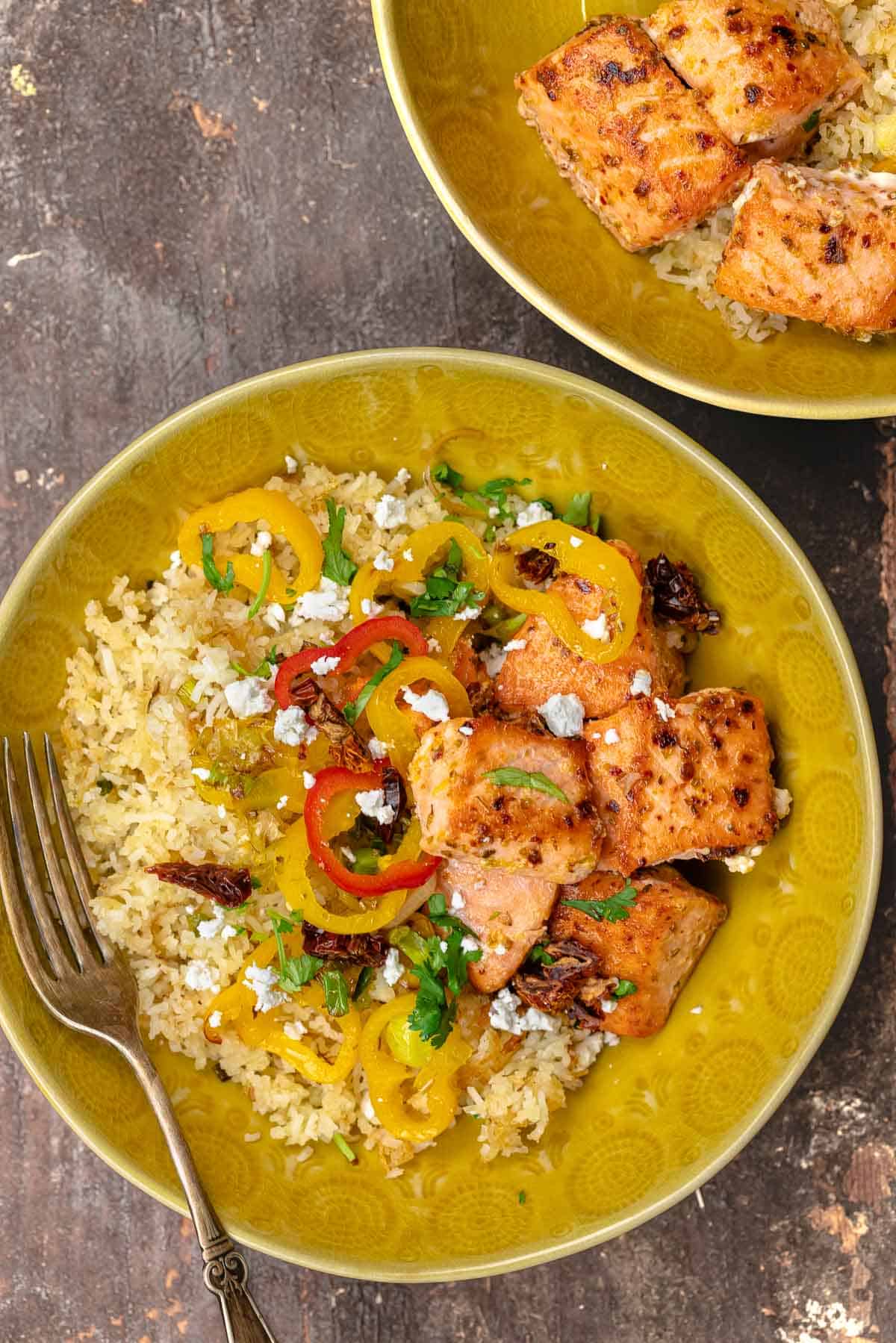 crispy salmon rice bowl with another in the background