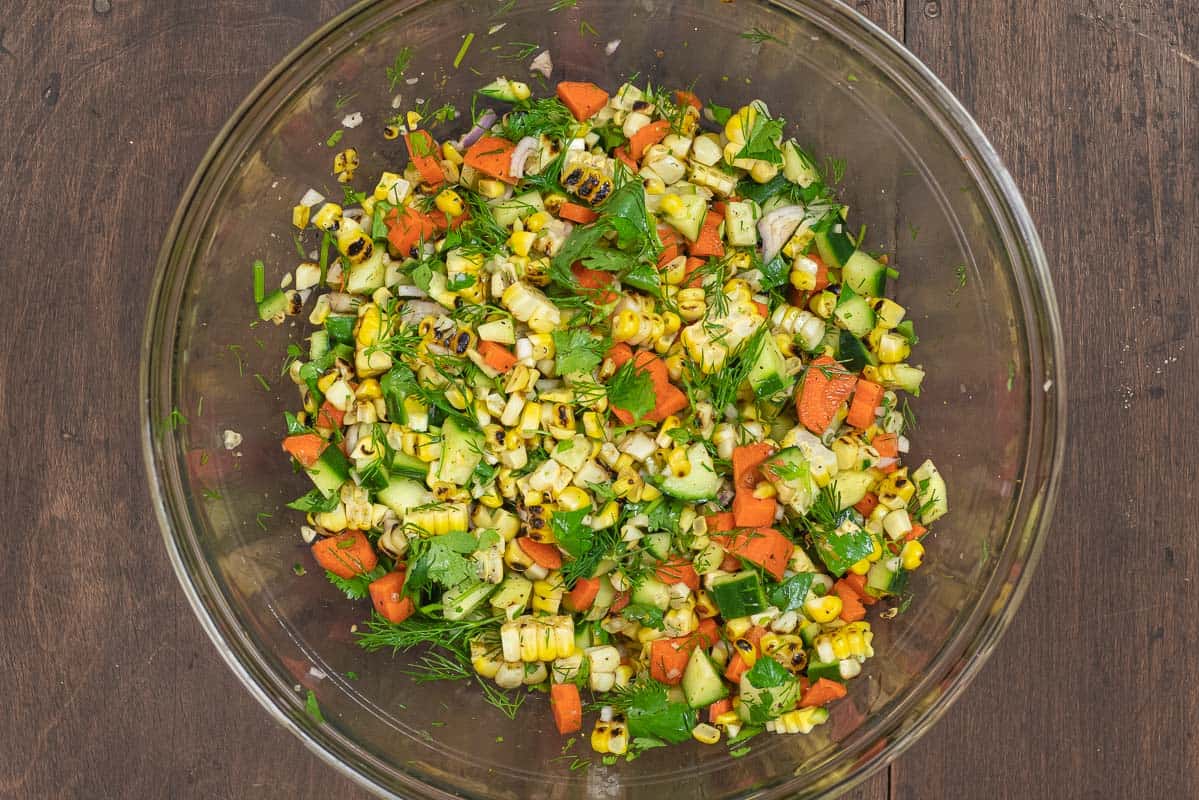 summer corn salad with vegetables, cilantro, and dill.