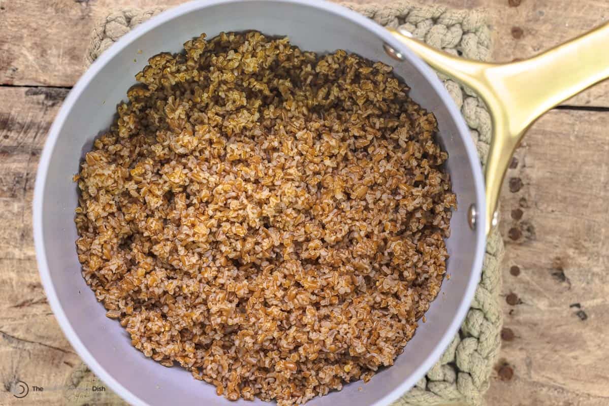 cooked coarse bulgur wheat in a saucepan