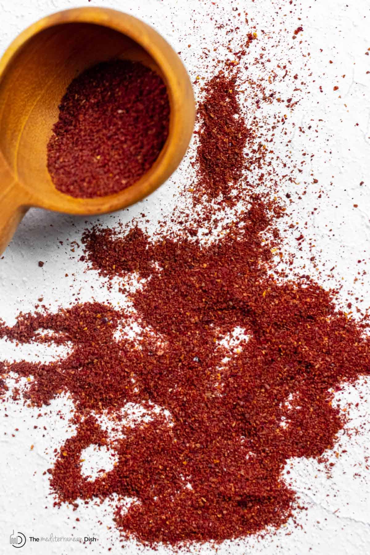 deep red sumac sprinkled onto a flat surface.