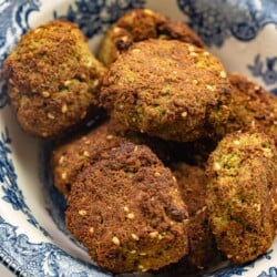 several air fryer falafel patties in a blue and white bowl.