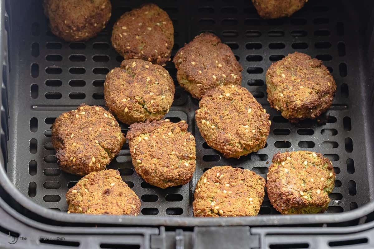 close up of falafel disks in an air fryer.