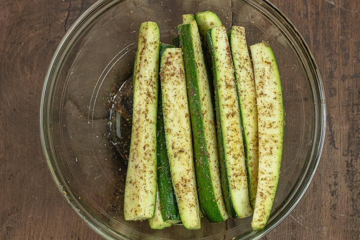 zucchini spears seasoned with spices and extra virgin olive oil.