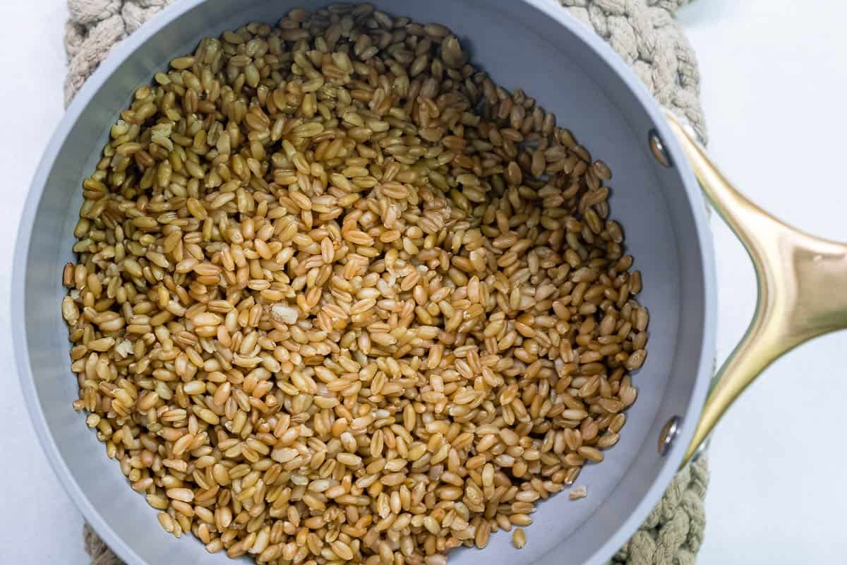 Cooked freekeh grains in a large saucepan.