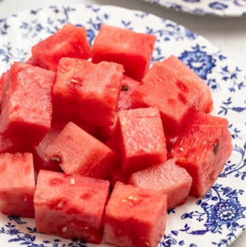 watermelon cubes on a blue and white plate.