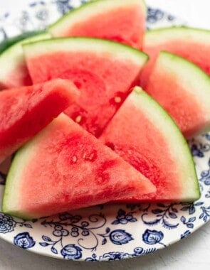 watermelon wedges on a blue and white plate.