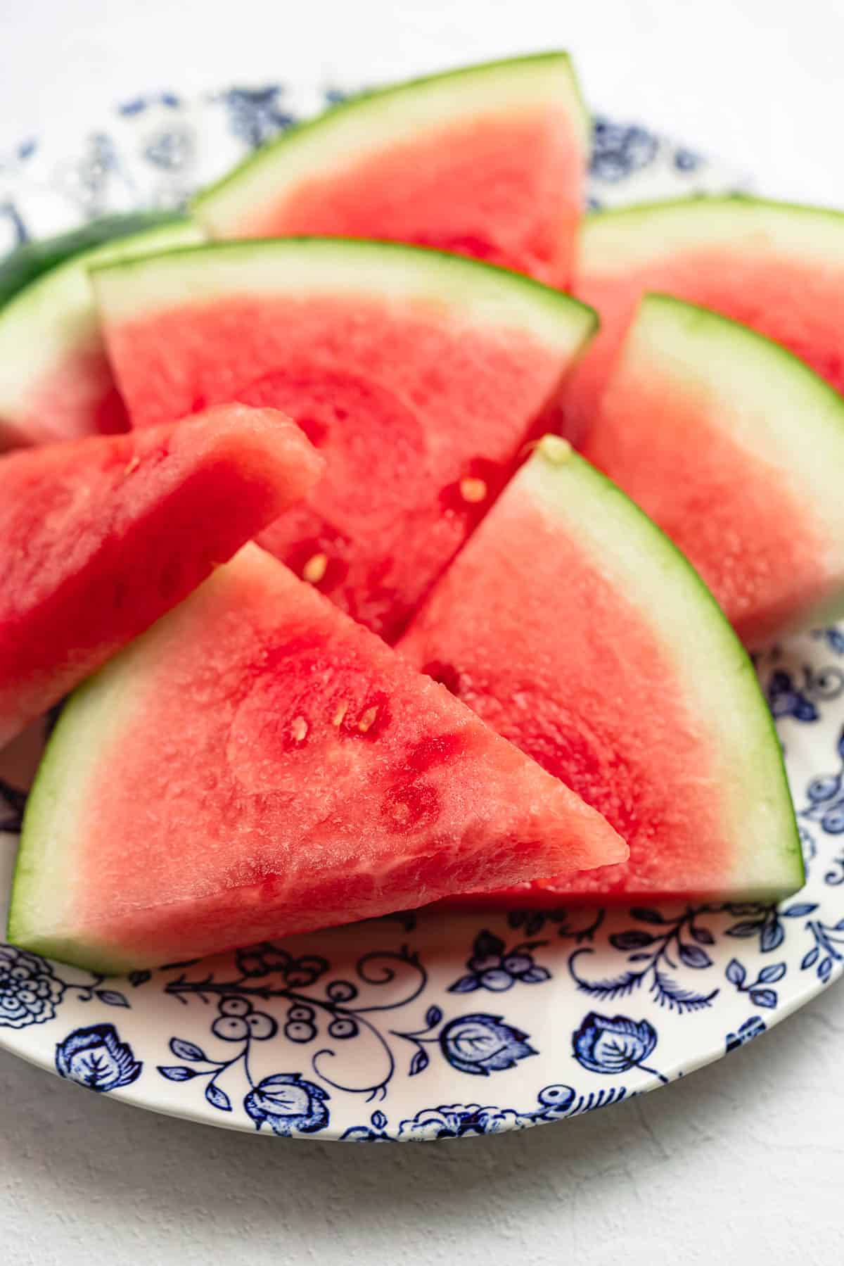 watermelon wedges on a blue and white plate.