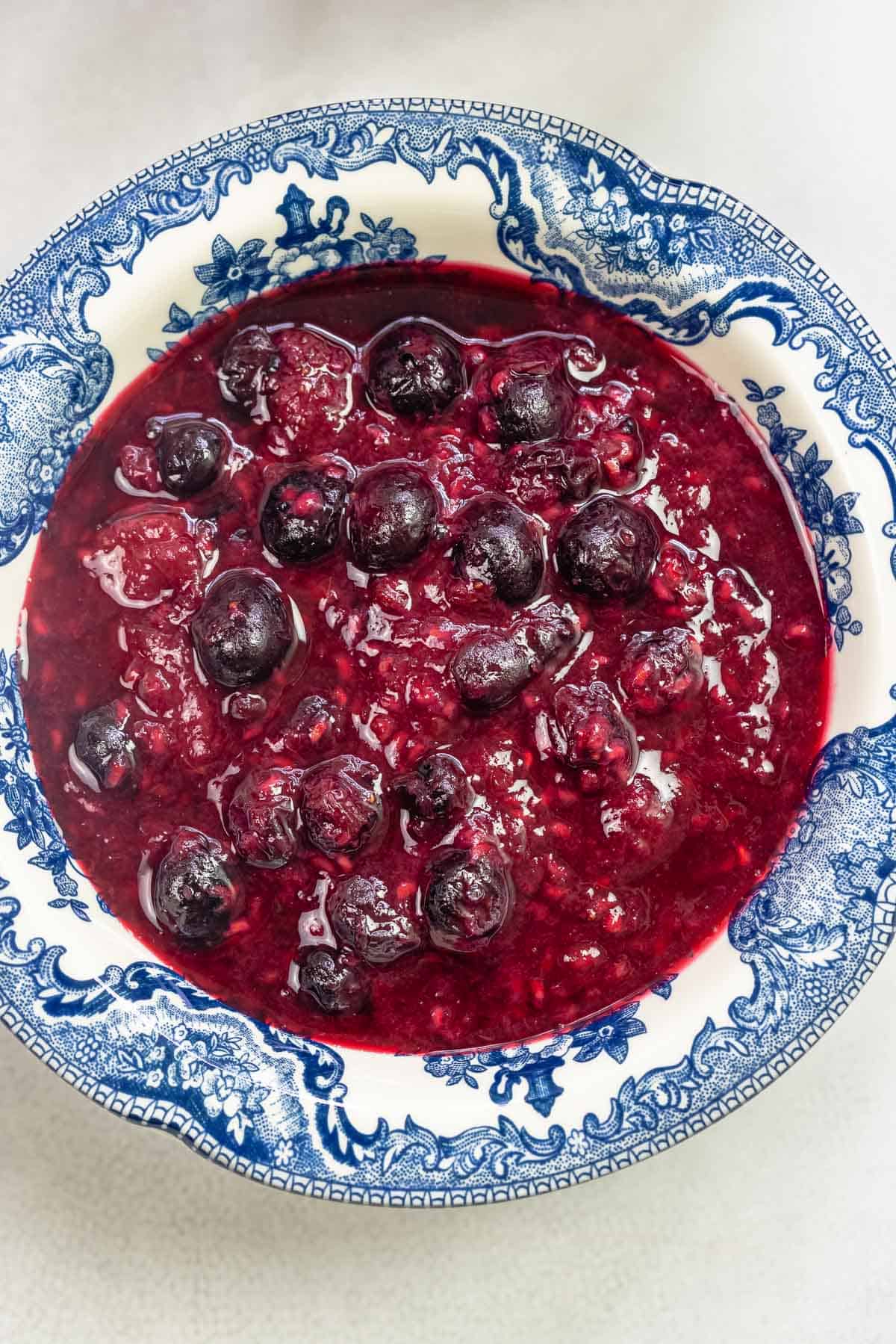 fruit compote in a blue and white bowl.