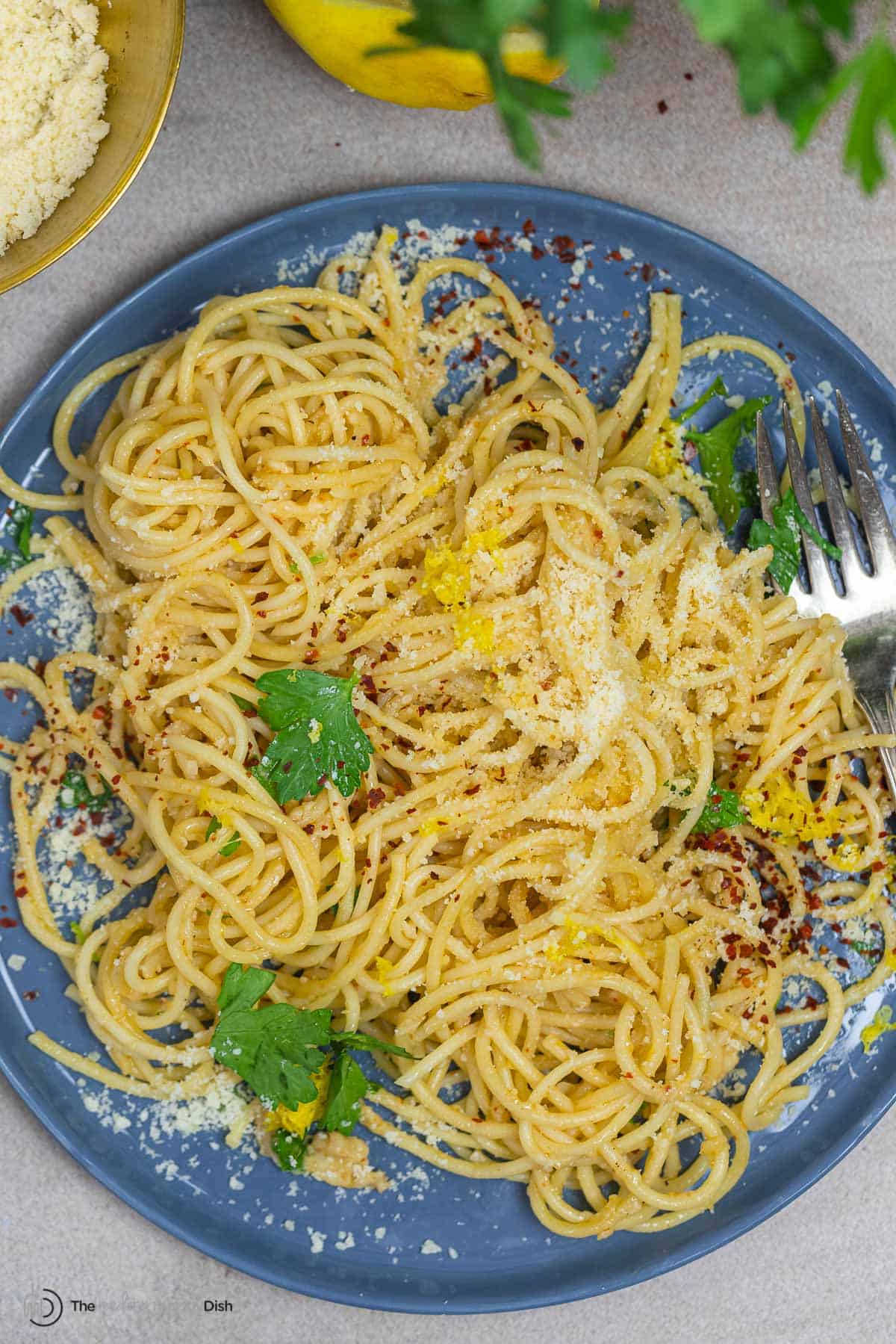 close-up of grated parmesan cheese coming down from the rotating