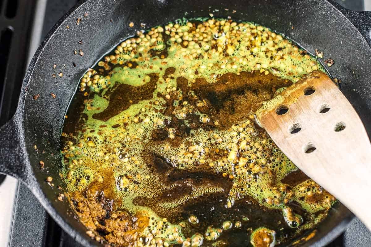 spices and extra virgin olive oil in a cast-iron skillet.