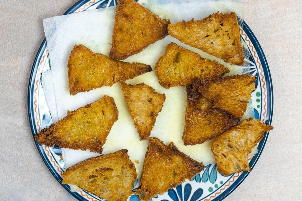 fried triangles of sourdough bread.