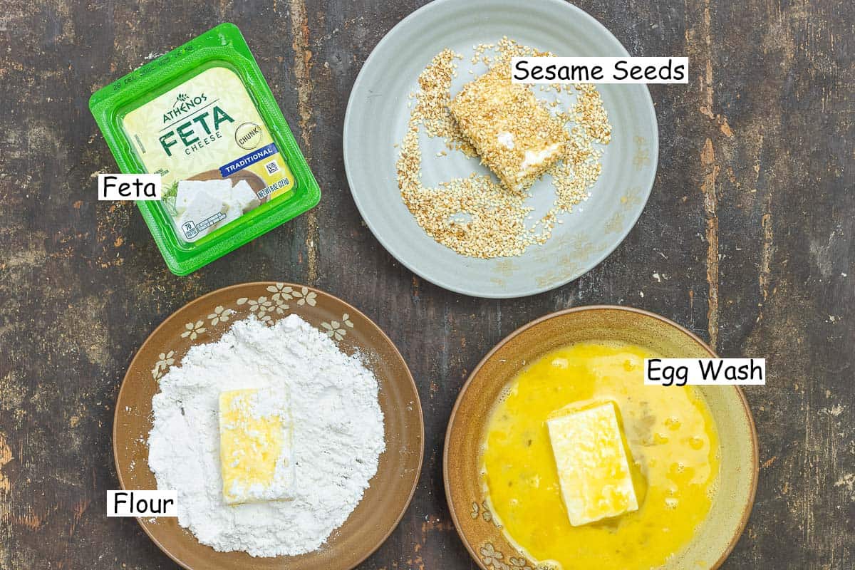 labeled ingredient and step image for fried feta cheese including a block of Athenos feta cheese, toasted sesame seeds, eggs beaten with water, and flour.