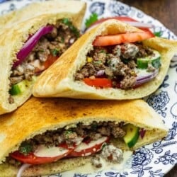 ground beef pita sandwiches on a plate.