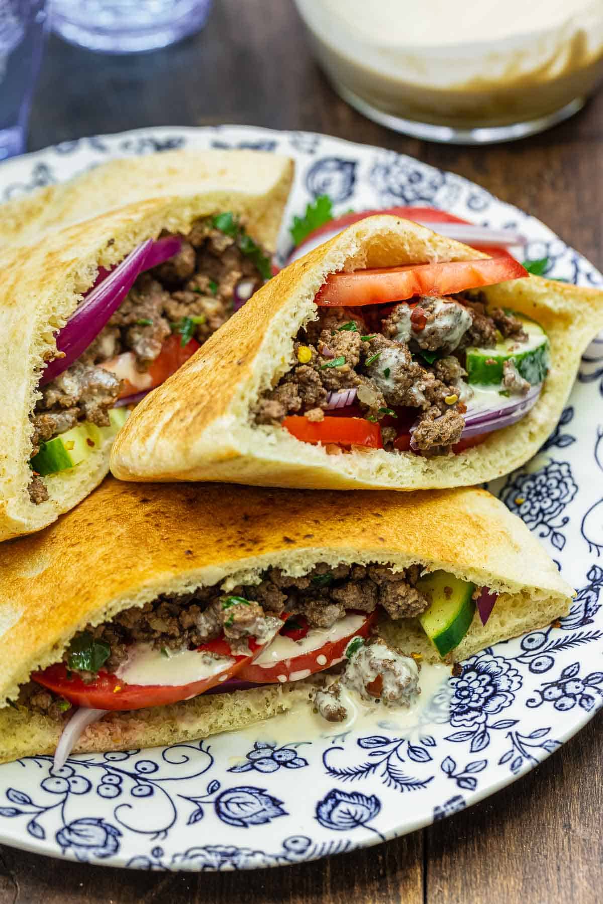 ground beef pita sandwiches on a plate.