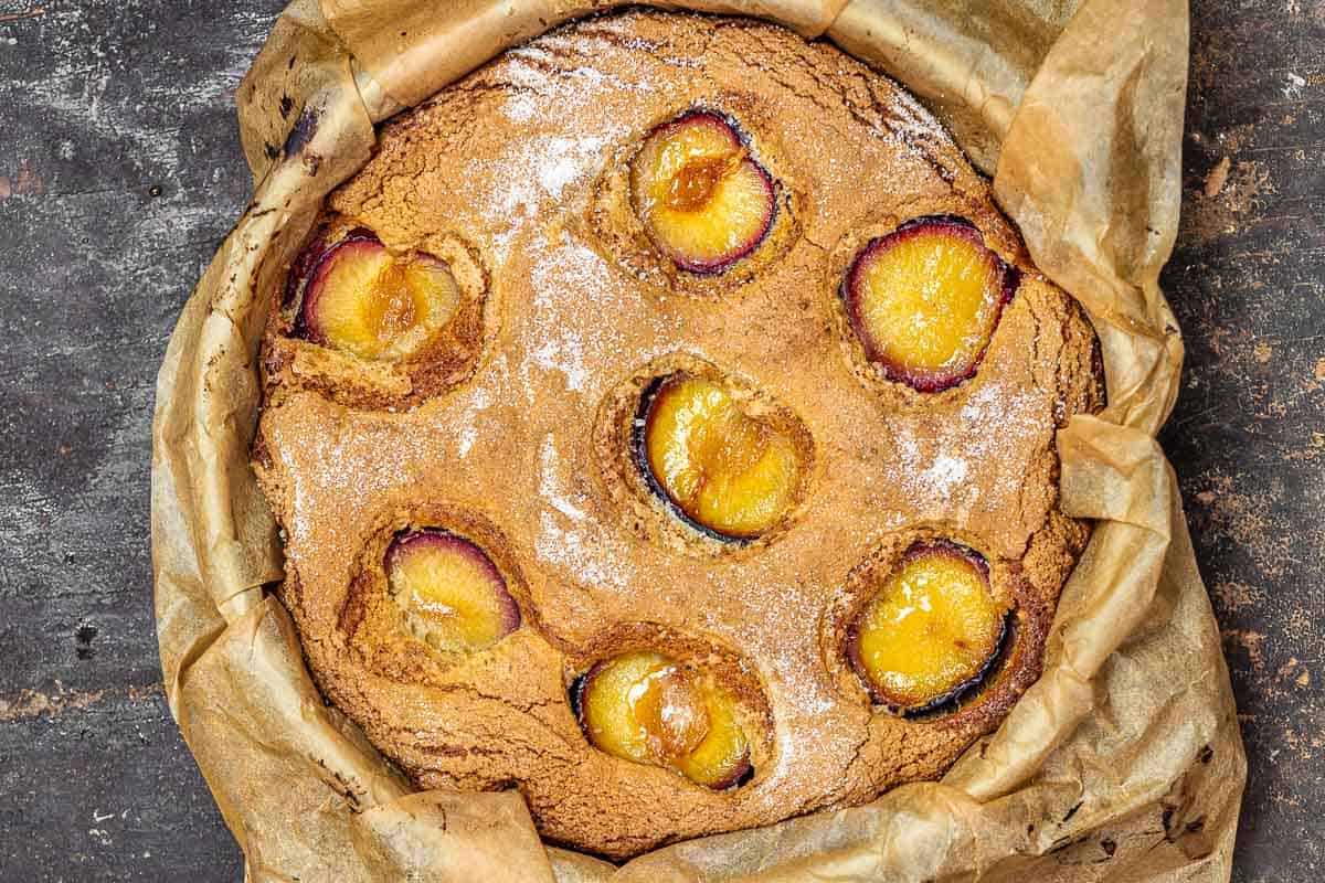 baked plum cake in a springform pan.