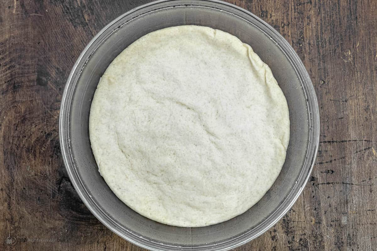 uncooked dough for bread rolls with za'atar.