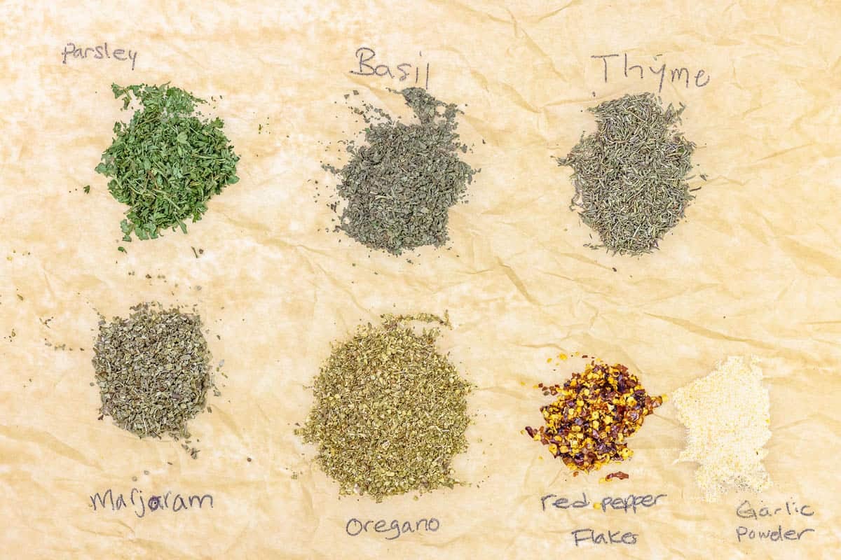 labeled ingredients for Italian seasoning including thyme, basil, parsley, marjoram, oregano, red pepper flakes, and garlic powder.