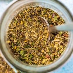 Homemade Italian seasoning in a glass jar.