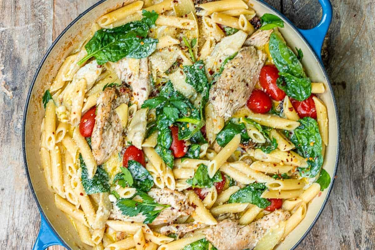 chicken penne with spinach and cherry tomatoes.