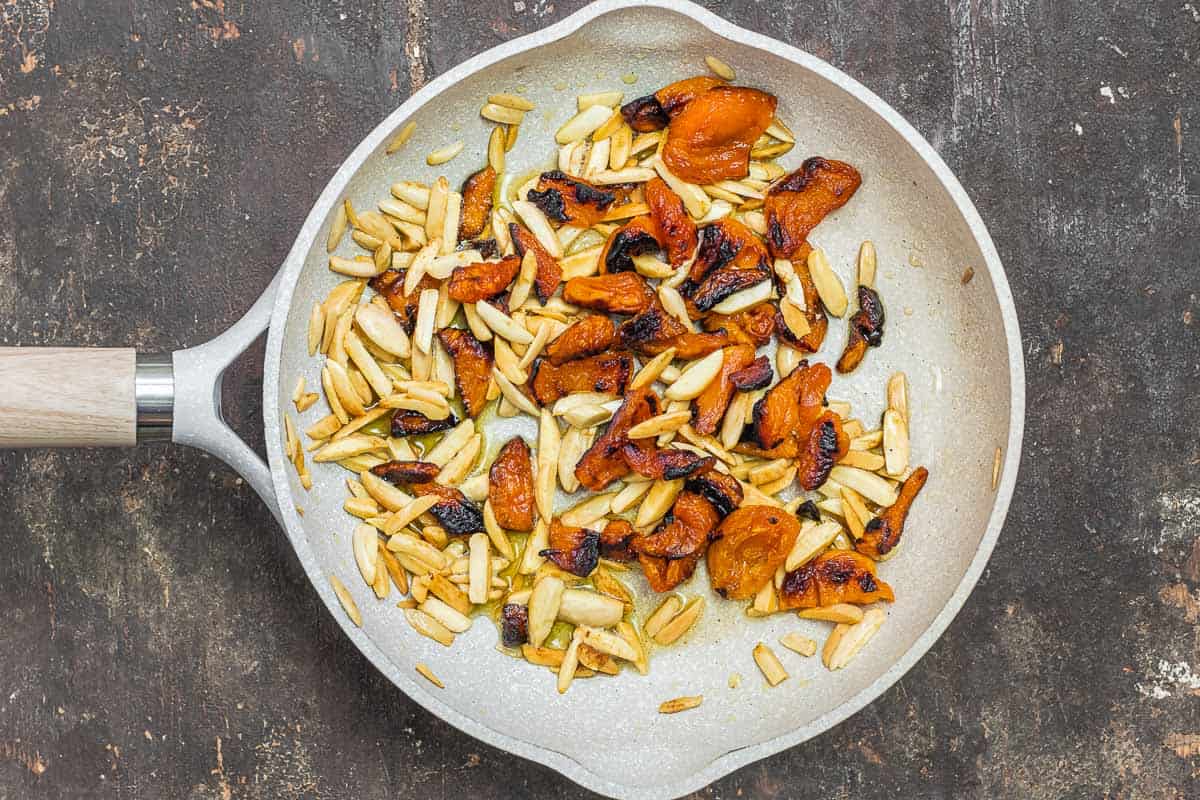 slivered almonds and dried apricots in a non-stick skillet.