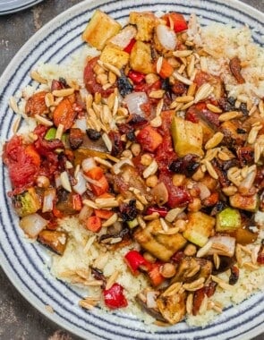 roasted vegetables on a bed of couscous served on a plate.