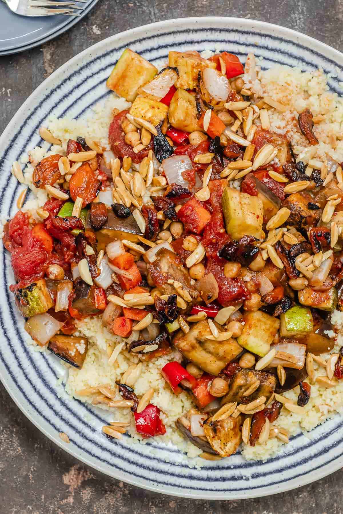 roasted vegetables on a bed of couscous served on a plate.