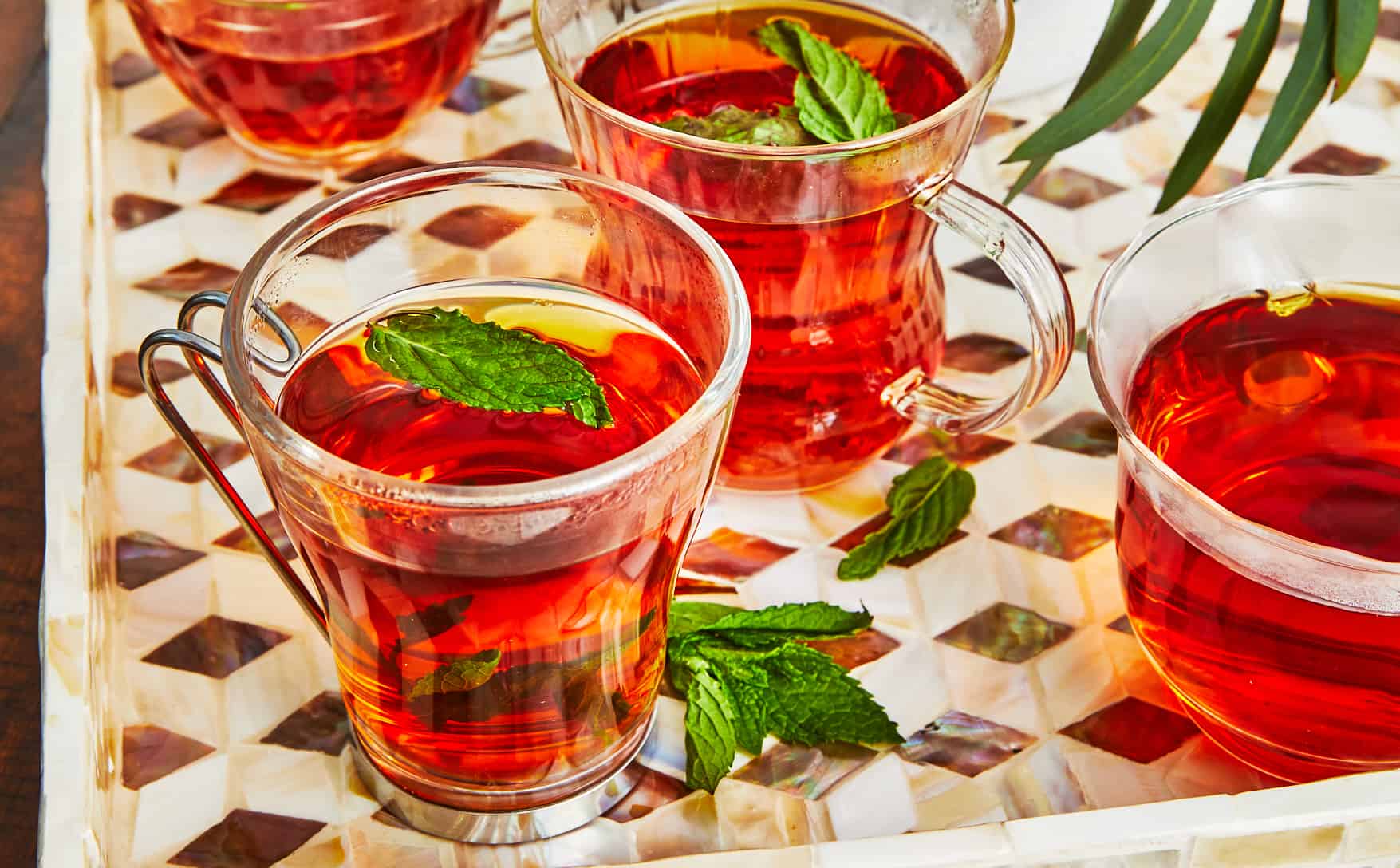 Close up of Arabic tea with mint in a glass mug.