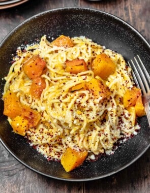 pasta with butternut puree and chunks of butternut in a bowl.