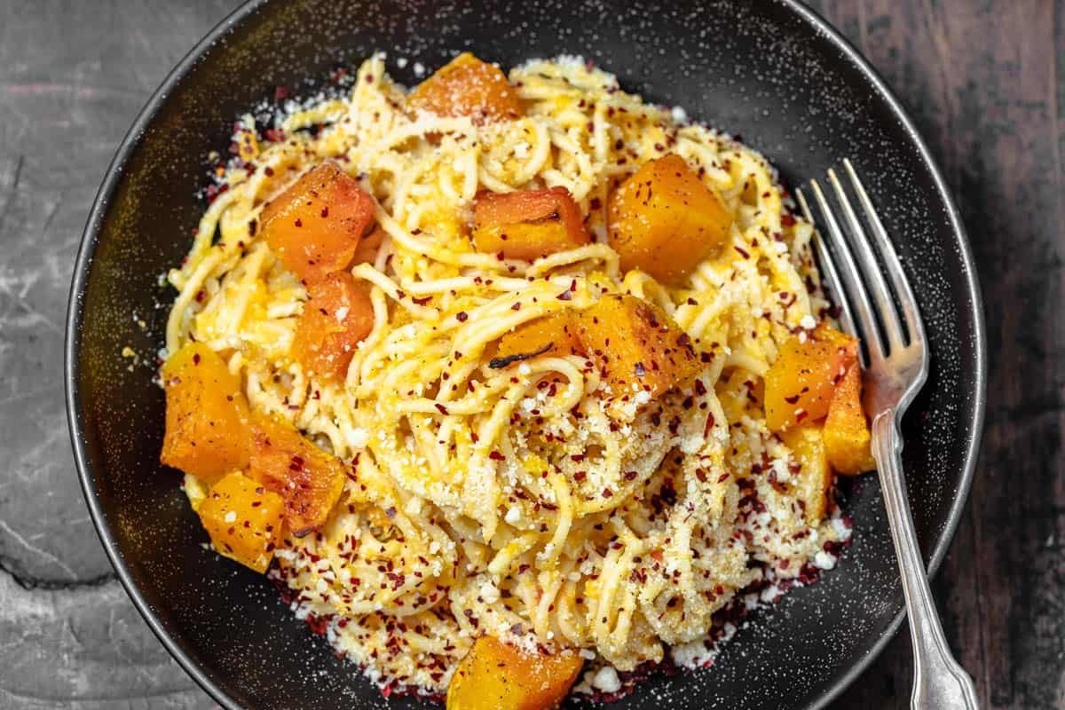 butternut squash pasta with cheese sprinkled on top.