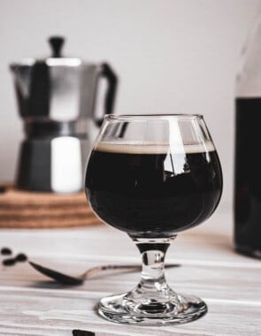 Coffee cocktail in a glass goblet.