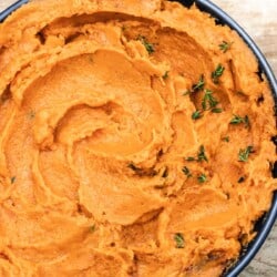 savory mashed sweet potatoes with herbs and garlic.