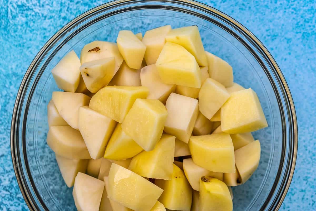 sliced potatoes in a glass bowl.