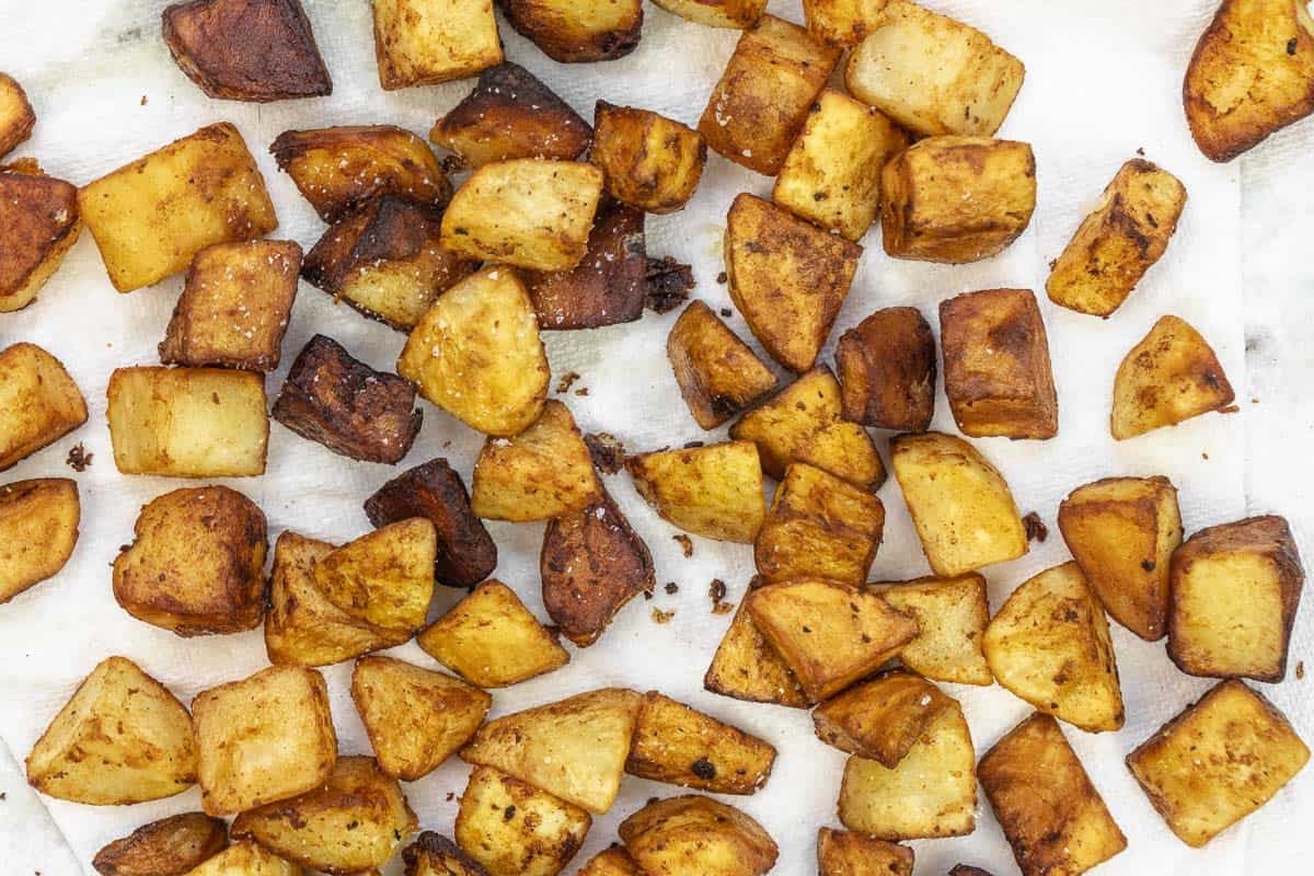 fried potatoes on a paper towel.