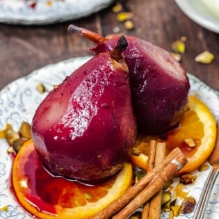 poached pear recipe with red wine, oranges, and spices.