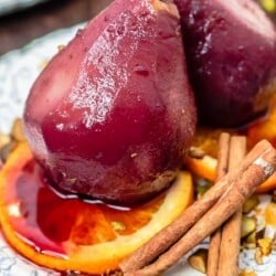 poached pear on a plate.