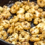 shrimp sautÃ©ing in a skillet.