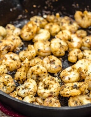 shrimp sautéing in a skillet.