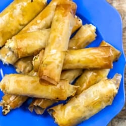 Sigara boregi rolls on a blue plate.