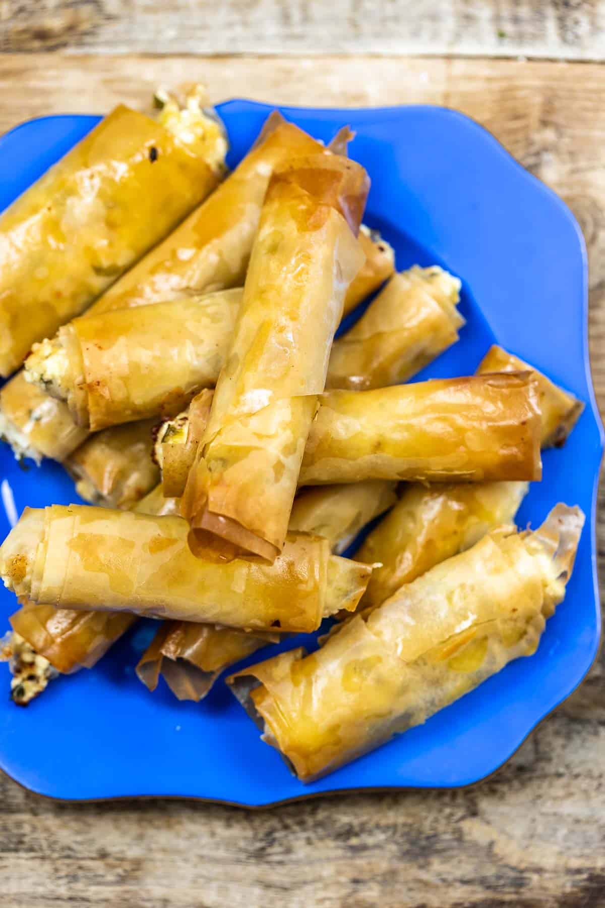 Sigara boregi rolls on a blue plate.