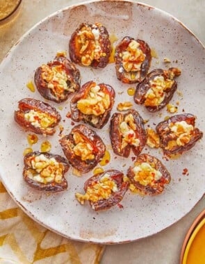overhead shot of cheese stuffed dates on a plate.