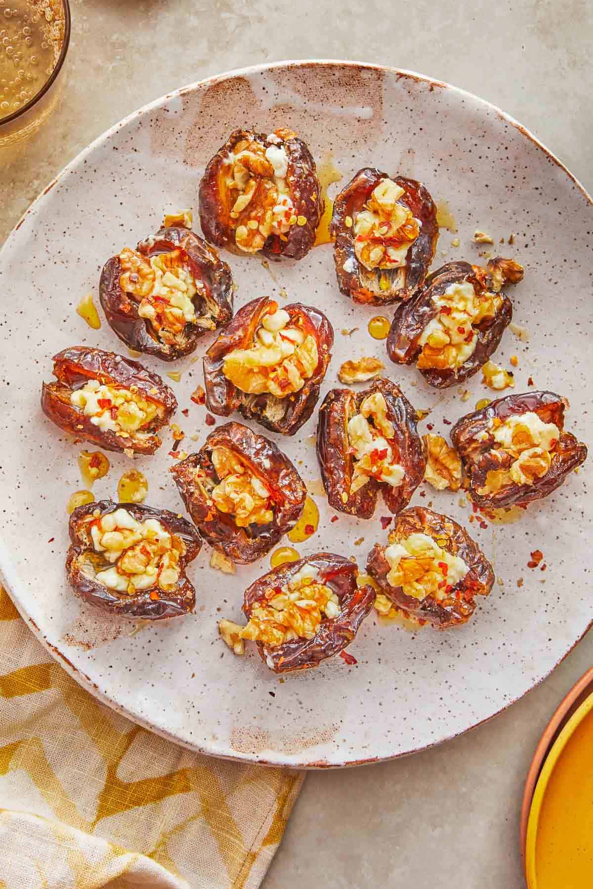 overhead shot of cheese stuffed dates on a plate.