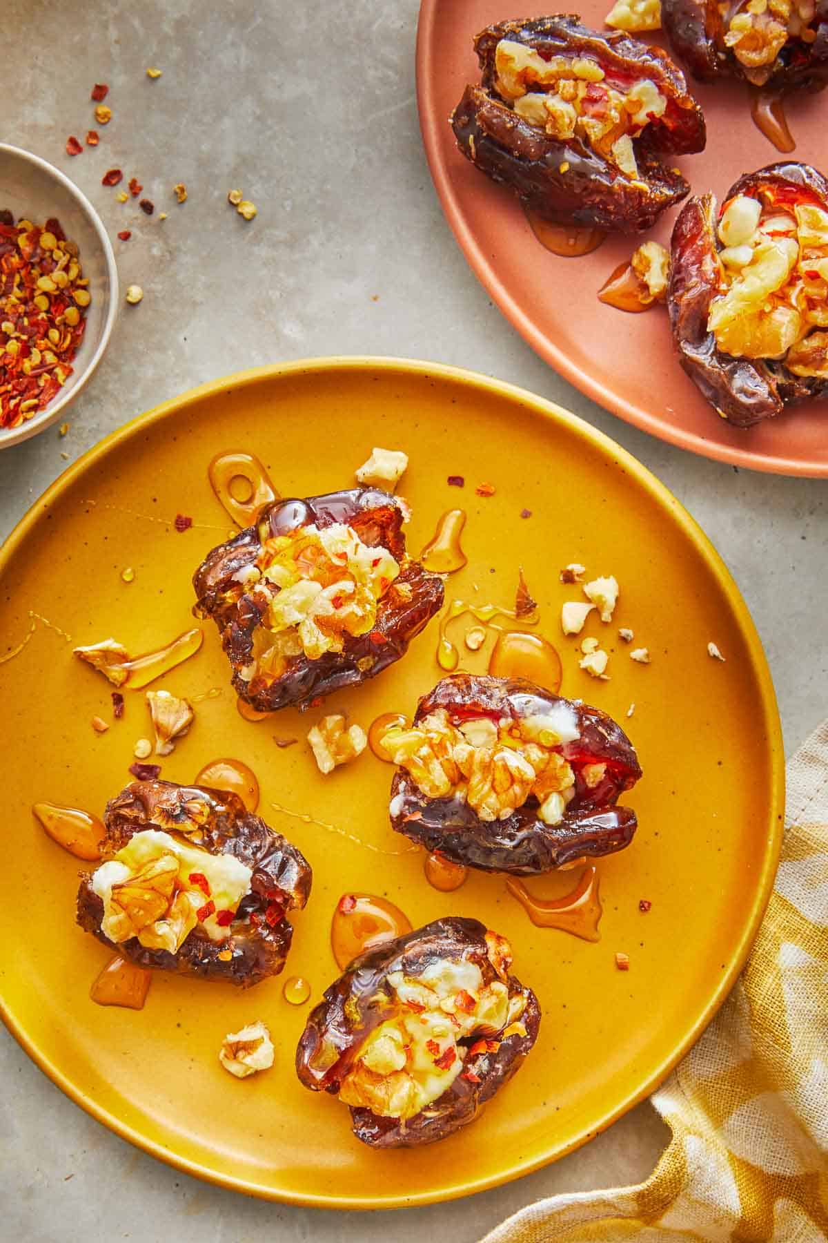 overhead shot of four cheese stuffed dates on a plate.