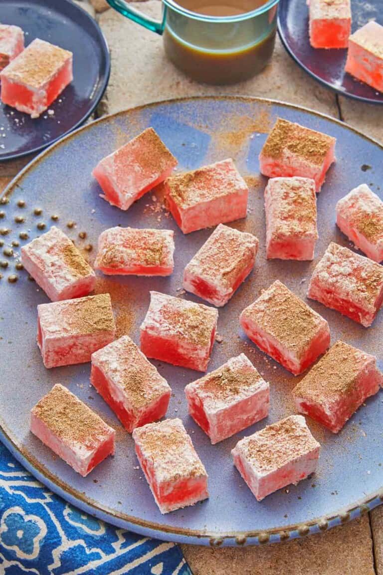 close up of pieces of turkish delight on a serving plate.