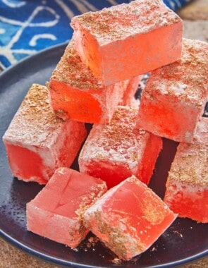 pieces of turkish delight (lokum) stacked on a small plate.